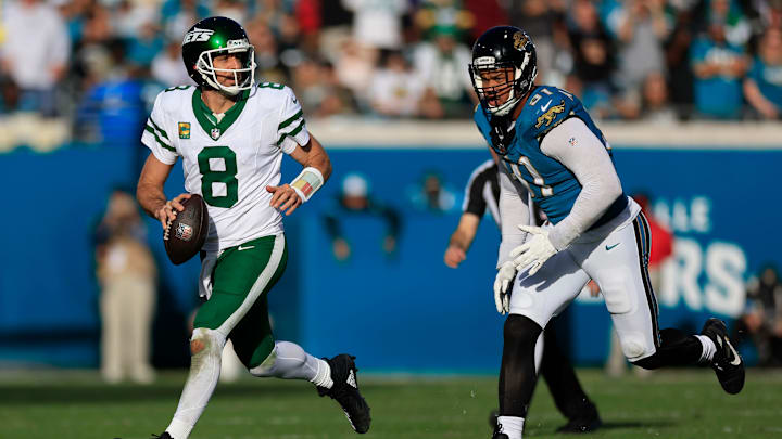 New York Jets quarterback Aaron Rodgers (8) is pressured by Jacksonville Jaguars defensive end Arik Armstead (91) during the fourth quarter Sunday, Dec. 15, 2024 at EverBank Stadium in Jacksonville, Fla. The Jets held off the Jaguars 32-25. [Corey Perrine/Florida Times-Union]