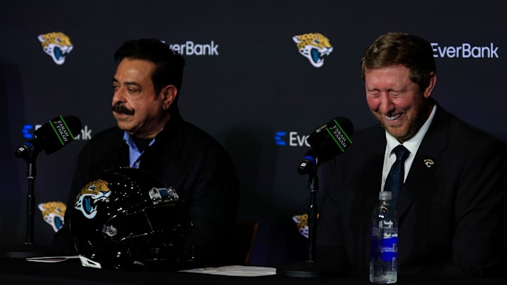 New Jaguars head coach Liam Coen, right, reacts to a sarcastic moment when Jaguars owner Shad Khan asks if a reporter can ask a tougher question during a press conference Monday, Jan. 27, 2025 at the Miller Electric Center in Jacksonville, Fla. [Corey Perrine/Florida Times-Union]