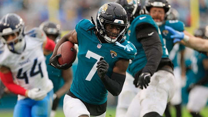 Jacksonville Jaguars wide receiver Brian Thomas Jr. (7) rushes for yards during the second quarter of an NFL football matchup Sunday, Dec. 29, 2024 at EverBank Stadium in Jacksonville, Fla. The Jaguars held off the Titans 20-13. [Corey Perrine/Florida Times-Union]