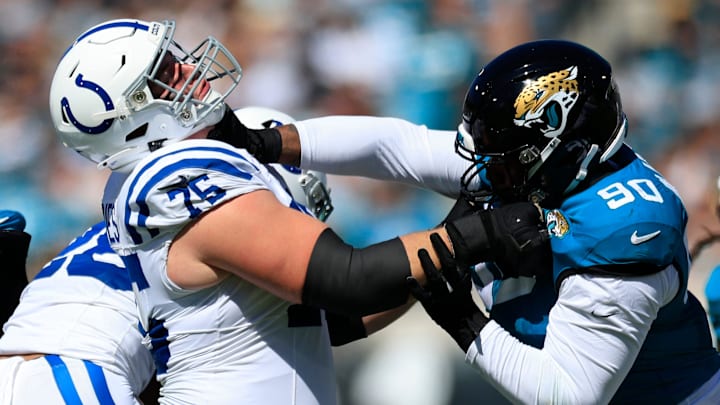 Indianapolis Colts guard Will Fries (75) tangles up with Jacksonville Jaguars defensive end Angelo Blackson (90) during the second quarter of an NFL football matchup Sunday, Oct. 15, 2023 at EverBank Stadium in Jacksonville, Fla. The Jacksonville Jaguars defeated the Indianapolis Colts 37-20. [Corey Perrine/Florida Times-Union]