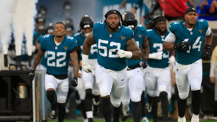 Jacksonville Jaguars defensive tackle DaVon Hamilton (52) leads the team onto the field before an NFL football matchup Sunday, Dec. 29, 2024 at EverBank Stadium in Jacksonville, Fla. The Jaguars held off the Titans 20-13. [Corey Perrine/Florida Times-Union]