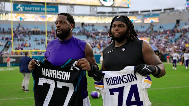 Minnesota Vikings offensive tackle Cam Robinson (74), left, holds up a signed jersey of Jacksonville Jaguars offensive tackle Anton Harrison (77), and vice versa, after the game of an NFL football matchup Sunday, Nov. 10, 2024 at Everbank Stadium in Jacksonville, Fla. The Vikings defeated the Jaguars 12-7. [Corey Perrine/Florida Times-Union]