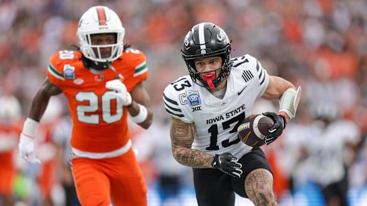 Dec 28, 2024; Orlando, FL, USA; Iowa State Cyclones wide receiver Jaylin Noel (13) runs with the ball against the Miami Hurricanes in the first quarter during the Pop Tarts bowl at Camping World Stadium. Mandatory Credit: Nathan Ray Seebeck-Imagn Images Dec 28, 2024; Orlando, FL, USA; Iowa State Cyclones wide receiver Jaylin Noel (13) runs with the ball against the Miami Hurricanes in the first quarter during the Pop Tarts bowl at Camping World Stadium. Mandatory Credit: Nathan Ray Seebeck-Imagn Images