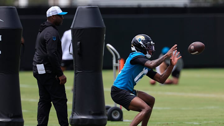 Jacksonville Jaguars wide receiver Travis Hunter (12) catches as pass during a rookie minicamp at Miller Electric Center Saturday, May 10, 2025 in Jacksonville, Fla. [Corey Perrine/Florida Times-Union]