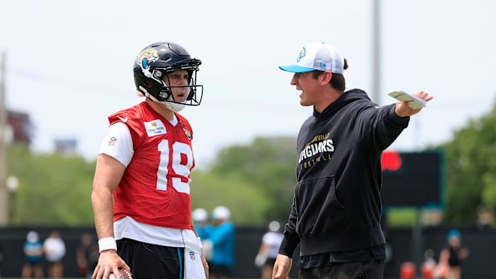 Jacksonville Jaguars quarterback Seth Henigan (19) listens to offensive coordinator Grant Udinski during a rookie minicamp at Miller Electric Center Saturday, May 10, 2025 in Jacksonville, Fla. [Corey Perrine/Florida Times-Union]