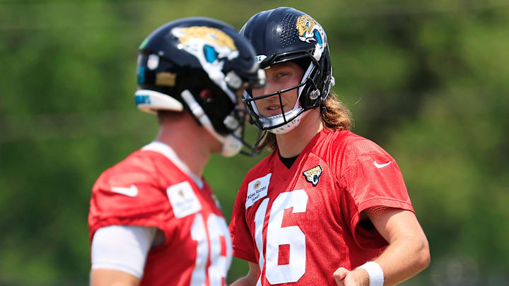 Jacksonville Jaguars quarterback Trevor Lawrence (16) looks on to quarterback John Wolford (18) during the first organized team activity at Miller Electric Center Monday, May 19, 2025 in Jacksonville, Fla.