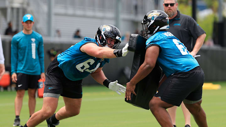 Jacksonville Jaguars guard Wyatt Milum (64), left, drills on guard Sal Wormley (61) during a rookie minicamp at Miller Electric Center Saturday, May 10, 2025 in Jacksonville, Fla. [Corey Perrine/Florida Times-Union]