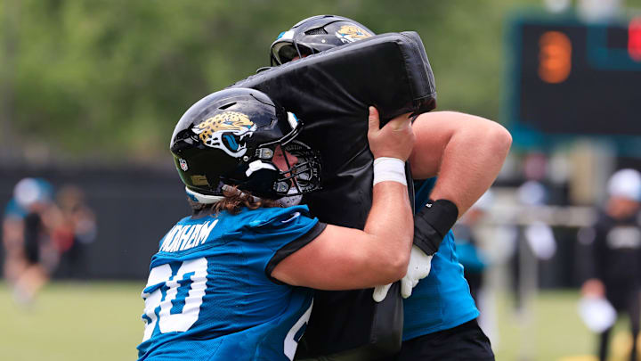 Jacksonville Jaguars center Jonah Monheim (60), left, drills with guard Wyatt Milum (64) during a rookie minicamp at Miller Electric Center Saturday, May 10, 2025 in Jacksonville, Fla. [Corey Perrine/Florida Times-Union]