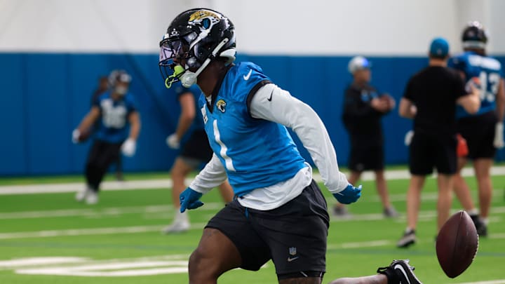 Jacksonville Jaguars running back Travis Etienne Jr. (1) can’t make a catch during the 10th organized team activity at Miller Electric Center Wednesday, June 4, 2025 in Jacksonville, Fla. [Corey Perrine/Florida Times-Union]
