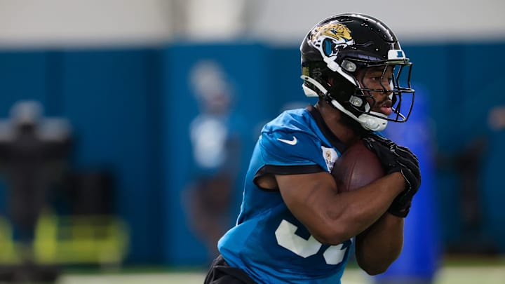 Jacksonville Jaguars running back Bhayshul Tuten (33) runs the ball during the 10th organized team activity at Miller Electric Center Wednesday, June 4, 2025 in Jacksonville, Fla. [Corey Perrine/Florida Times-Union]
