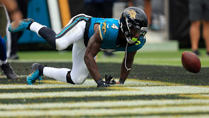 Jacksonville Jaguars running back Tank Bigsby (4) loses the ball in the end zone that he would recover for the touchdown score during the third quarter of an NFL football matchup Sunday, Oct. 6, 2024 at EverBank Stadium in Jacksonville, Fla. The Jaguars edged the Colts on a field goal 37-34. [Corey Perrine/Florida Times-Union]