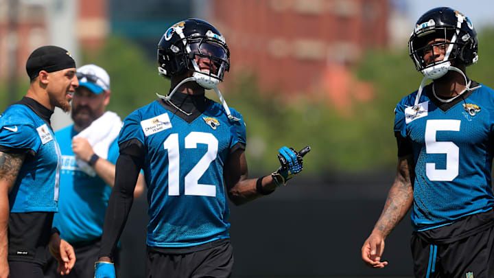 Jacksonville Jaguars wide receiver Travis Hunter (12) smiles with wide receiver Dyami Brown (5) during the 10th organized team activity at Miller Electric Center Wednesday, June 4, 2025 in Jacksonville, Fla. [Corey Perrine/Florida Times-Union]