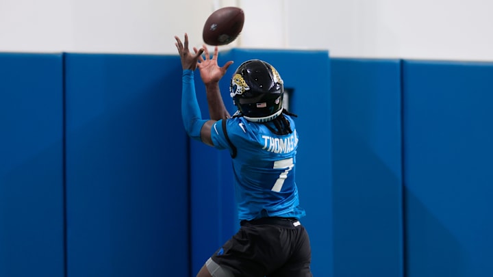 Jacksonville Jaguars wide receiver Brian Thomas Jr. (7) catches a pass during the 10th organized team activity at Miller Electric Center Wednesday, June 4, 2025 in Jacksonville, Fla. [Corey Perrine/Florida Times-Union]