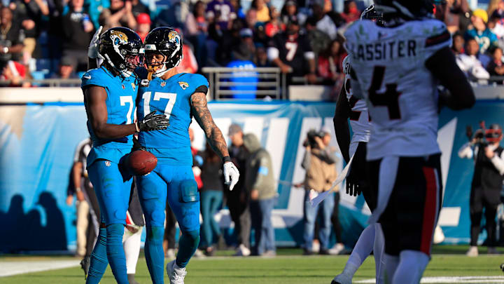Jacksonville Jaguars wide receiver Brian Thomas Jr. (7) celebrates his touchdown with tight end Evan Engram (17) during the fourth quarter of an NFL football matchup Sunday, Dec. 1, 2024 at EverBank Stadium in Jacksonville, Fla. The Texans held off the Jaguars 23-20. [Corey Perrine/Florida Times-Union]