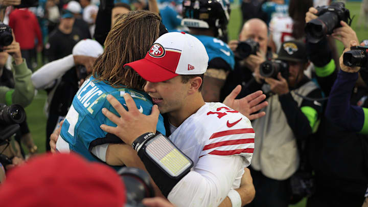 Jacksonville Jaguars quarterback Trevor Lawrence (16) hugs San Francisco 49ers quarterback Brock Purdy (13) after the game of an NFL football game Sunday, Nov. 12, 2023 at EverBank Stadium in Jacksonville, Fla. The San Francisco 49ers defeated the Jacksonville Jaguars 34-3. [Corey Perrine/Florida Times-Union]