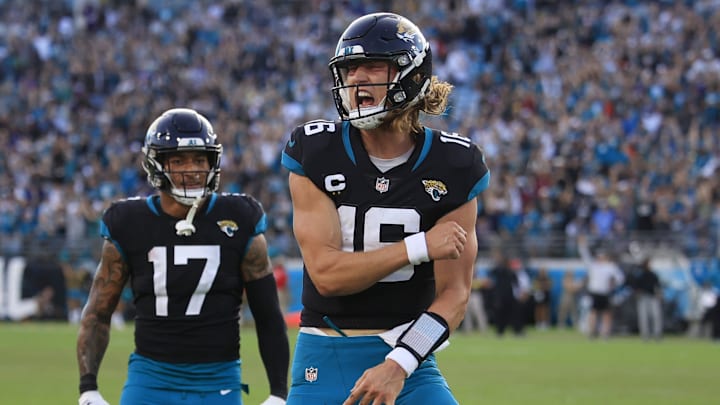 Jacksonville Jaguars quarterback Trevor Lawrence (16) reacts to his touchdown pass as teammate tight end Evan Engram (17) looks on during the fourth quarter of a regular season NFL football matchup Sunday, Nov. 27, 2022 at TIAA Bank Field in Jacksonville. The Jaguars edged the Ravens 28-27. Jacksonville Jaguars quarterback Trevor Lawrence (16) reacts to his touchdown pass as teammate tight end Evan Engram (17) looks on during the fourth quarter of a regular season NFL football matchup Sunday, Nov. 27, 2022 at TIAA Bank Field in Jacksonville. The Jaguars edged the Ravens 28-27.
