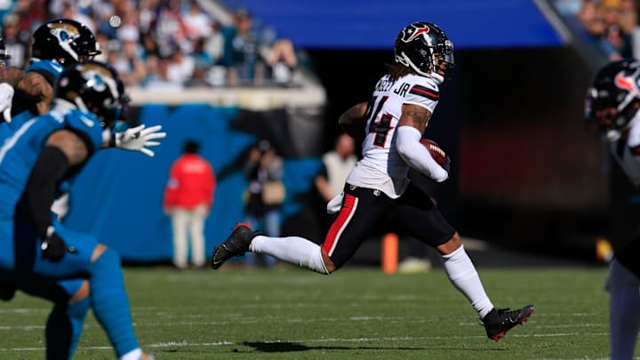 Houston Texans cornerback Derek Stingley Jr. (24) hauls in an interception during the second quarter of an NFL football matchup Sunday, Dec. 1, 2024 at EverBank Stadium in Jacksonville, Fla. [Corey Perrine/Florida Times-Union]