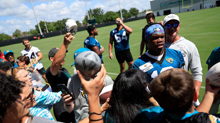 Jacksonville Jaguars wide receiver Travis Hunter (12) signs autographs for fans during the second mandatory minicamp at Miller Electric Center Wednesday, June 11, 2025 in Jacksonville, Fla. Jacksonville Jaguars wide receiver Travis Hunter (12) signs autographs for fans during the second mandatory minicamp at Miller Electric Center Wednesday, June 11, 2025 in Jacksonville, Fla.