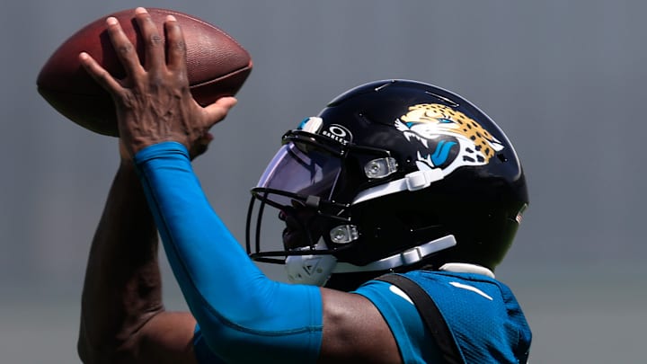 Jacksonville Jaguars wide receiver Brian Thomas Jr. (7) catches a pass from quarterback Trevor Lawrence (16), not shown, during the 10th organized team activity at Miller Electric Center Wednesday, June 4, 2025 in Jacksonville, Fla. [Corey Perrine/Florida Times-Union]
