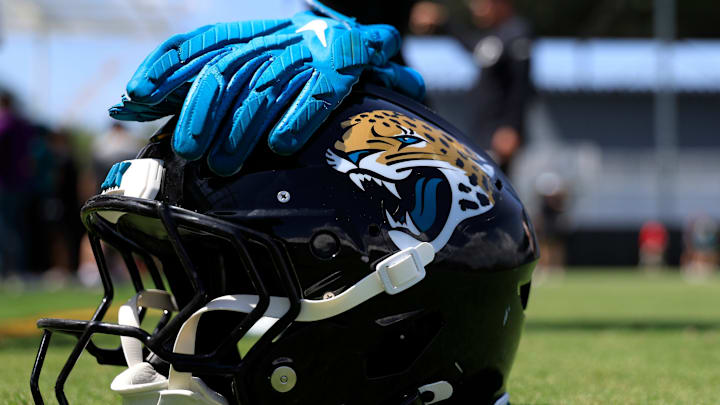 The helmet and gloves of Jacksonville Jaguars running back LeQuint Allen Jr. (36) sit on the field during the second mandatory minicamp at Miller Electric Center Wednesday, June 11, 2025 in Jacksonville, Fla.