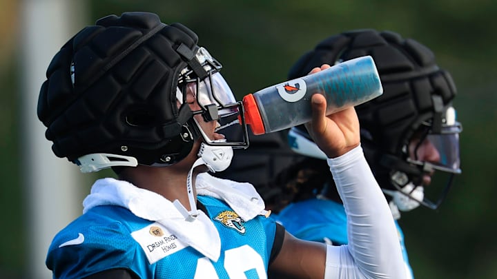 Jacksonville Jaguars wide receiver Travis Hunter (12) hydrates during an NFL training camp session at the Miller Electric Center, Sunday, Aug. 3, 2025, in Jacksonville, Fla. [Corey Perrine/Florida Times-Union]