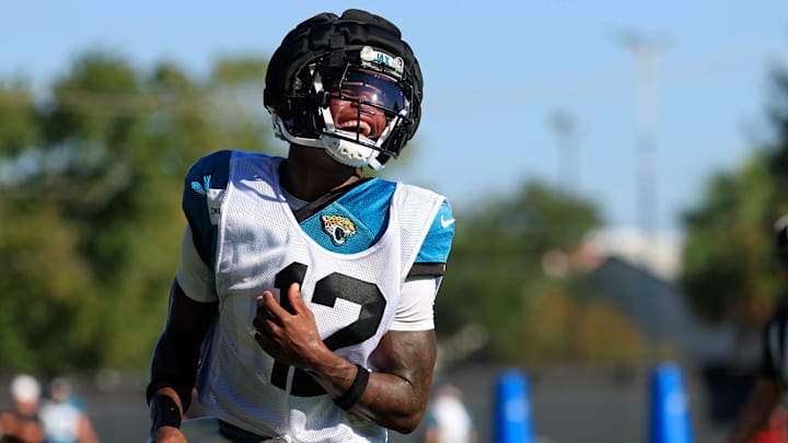 Jacksonville Jaguars wide receiver Travis Hunter (12) reacts during practices as cornerback Jarrian Jones (22) looks on during an NFL training camp session at the Miller Electric Center, Wednesday, Aug. 6, 2025, in Jacksonville, Fla. [Corey Perrine/Florida Times-Union]