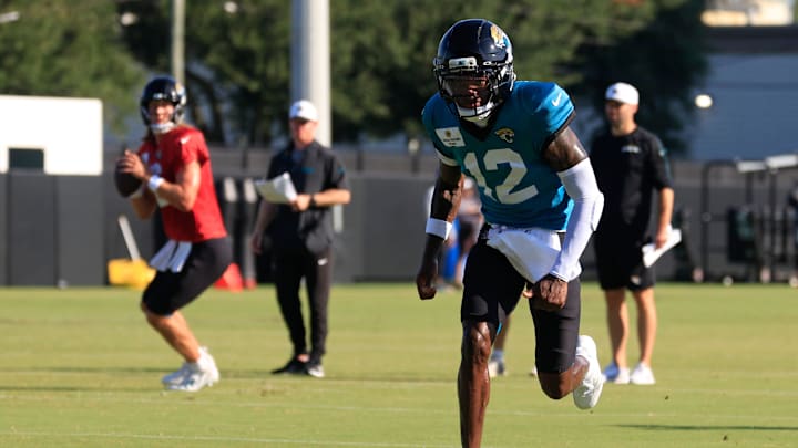 Jacksonville Jaguars wide receiver Travis Hunter (12) runs a route as quarterback Trevor Lawrence (16) looks to pass during an NFL training camp session at the Miller Electric Center, Tuesday, July 29, 2025, in Jacksonville, Fla. [Corey Perrine/Florida Times-Union]