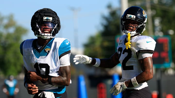 Jacksonville Jaguars wide receiver Travis Hunter (12) reacts during practices as cornerback Jarrian Jones (22) looks on during an NFL training camp session at the Miller Electric Center, Wednesday, Aug. 6, 2025, in Jacksonville, Fla. [Corey Perrine/Florida Times-Union]
