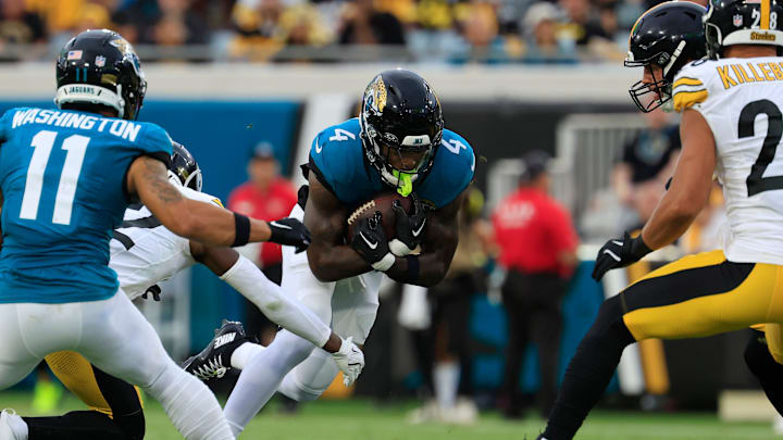 Jacksonville Jaguars running back Tank Bigsby (4) rushes for yards during the first quarter of an NFL preseason matchup at EverBank Stadium, Saturday, Aug. 9, 2025 in Jacksonville, Fla. [Corey Perrine/Florida Times-Union]