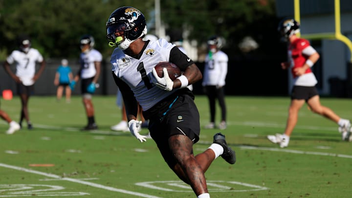 Jacksonville Jaguars running back Travis Etienne Jr. (1) runs the ball during an NFL training camp session at the Miller Electric Center, Monday, Aug. 11, 2025 in Jacksonville, Fla. [Corey Perrine/Florida Times-Union]