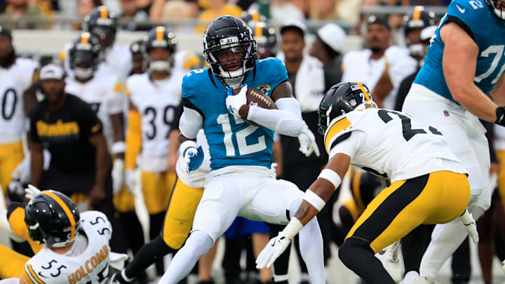 Jacksonville Jaguars wide receiver Travis Hunter (12) rushes for yards during the first quarter of an NFL preseason matchup at EverBank Stadium, Saturday, Aug. 9, 2025 in Jacksonville, Fla. [Corey Perrine/Florida Times-Union]