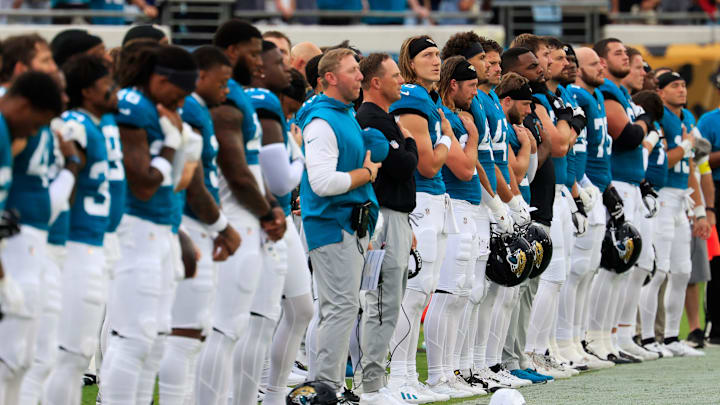 Jacksonville Jaguars quarterback Trevor Lawrence (16) llooks on during the national anthem before an NFL preseason matchup against the Pittsburgh Steelers at EverBank Stadium, Saturday, Aug. 9, 2025 in Jacksonville, Fla. [Corey Perrine/Florida Times-Union]