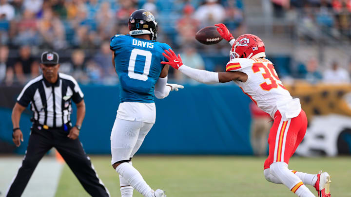 Jacksonville Jaguars wide receiver Gabe Davis (0) makes a catch but it is ruled out of bounds as Kansas City Chiefs cornerback Keith Taylor Jr. (39) defends during the first quarter of a preseason NFL football game Saturday, Aug. 10, 2024 at EverBank Stadium in Jacksonville, Fla. [Corey Perrine/Florida Times-Union]