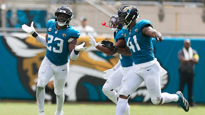 From left, Jacksonville Jaguars linebacker Foyesade Oluokun (23), reacts to a forced fuble turnover with cornerback Tyson Campbell (3), back, and defensive end Josh Hines-Allen (41) during the second quarter of an NFL football matchup at EverBank Stadium, Sunday, Sept. 7, 2025 in Jacksonville, Fla. [Corey Perrine/Florida Times-Union]