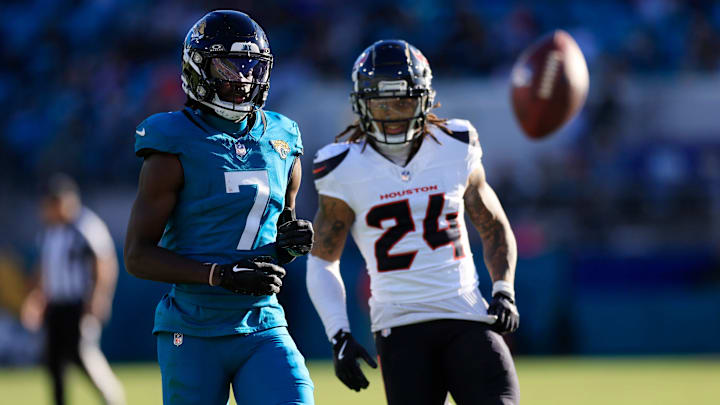 A pass intended for Jacksonville Jaguars wide receiver Brian Thomas Jr. (7) sails long against Houston Texans cornerback Derek Stingley Jr. (24) during the fourth quarter of an NFL football matchup Sunday, Dec. 1, 2024 at EverBank Stadium in Jacksonville, Fla. The Texans held off the Jaguars 23-20. [Corey Perrine/Florida Times-Union]