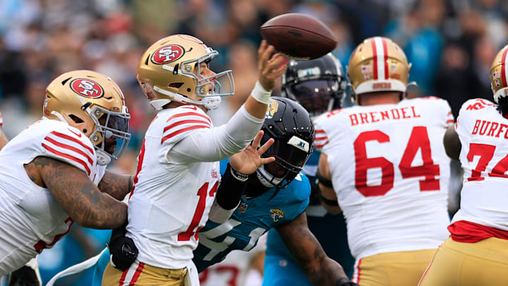 San Francisco 49ers quarterback Brock Purdy (13) throws the ball against Jacksonville Jaguars linebacker Josh Allen (41) during the second quarter of an NFL football game Sunday, Nov. 12, 2023 at EverBank Stadium in Jacksonville, Fla. The San Francisco 49ers defeated the Jacksonville Jaguars 34-3. [Corey Perrine/Florida Times-Union]