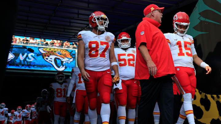 Kansas City Chiefs head coach Andy Reid, center, talks to quarterback Patrick Mahomes (15) next to tight end Travis Kelce (87) before a preseason NFL football game Saturday, Aug. 10, 2024 at EverBank Stadium in Jacksonville, Fla. The Jacksonville Jaguars defeated the Kansas City Chiefs 26-13. [Corey Perrine/Florida Times-Union]