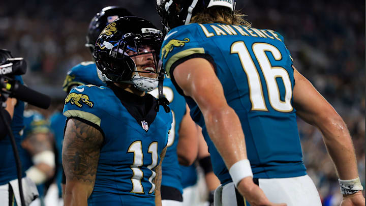 Jacksonville Jaguars quarterback Trevor Lawrence (16) cheers on wide receiver Parker Washington (11) for his touchdown score during the second quarter of an NFL football matchup at EverBank Stadium, Monday, Oct. 6, 2025, in Jacksonville, Fla. [Corey Perrine/Florida Times-Union]