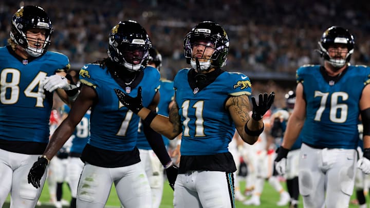 Jacksonville Jaguars wide receiver Parker Washington (11) celebrates his touchdown with wide receiver Brian Thomas Jr. (7), tight end Hunter Long (84) and guard Ezra Cleveland (76) during the second quarter of an NFL football matchup at EverBank Stadium, Monday, Oct. 6, 2025, in Jacksonville, Fla. The Jacksonville Jaguars edged the Kansas City Chiefs 31-28. [Corey Perrine/Florida Times-Union]