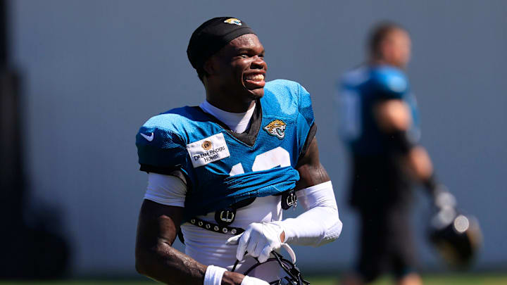 Jacksonville Jaguars wide receiver Travis Hunter (12) smiles as he walks off the field after an NFL training camp session at the Miller Electric Center, Tuesday, July 29, 2025, in Jacksonville, Fla. [Corey Perrine/Florida Times-Union]