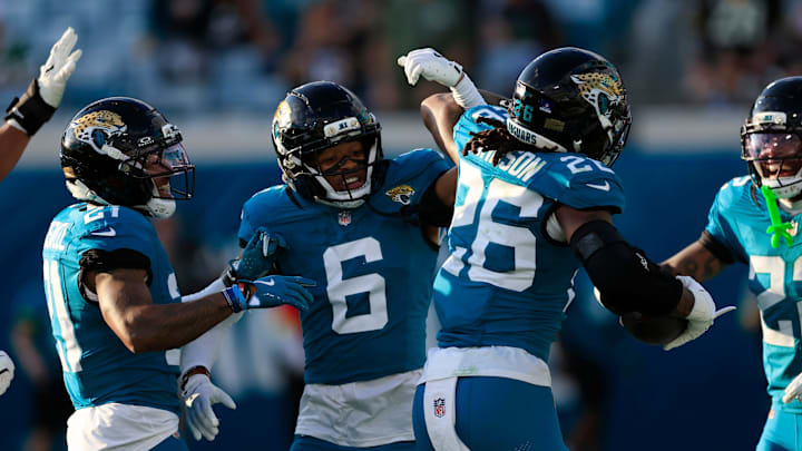 Jacksonville Jaguars cornerback Greg Newsome II (6) high-fives safety Antonio Johnson (26) for his interception during the fourth quarter of an NFL football matchup at EverBank Stadium, Sunday, Dec. 14, 2025, in Jacksonville, Fla. The Jaguars defeated the Jets 48-20. [Corey Perrine/Florida Times-Union]