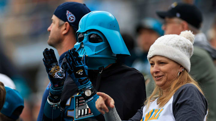 A fan dressed as teal Darth Vader claps during the second quarter of an NFL football matchup at EverBank Stadium, Sunday, Jan. 4, 2026, in Jacksonville, Fla. The Jaguars defeated the Titans 41-7, capturing the AFC South title. [Corey Perrine/Florida Times-Union]