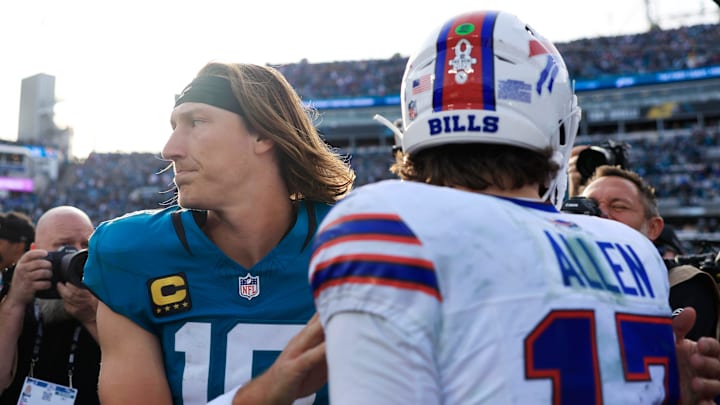Jacksonville Jaguars quarterback Trevor Lawrence (16) parts ways with Buffalo Bills quarterback Josh Allen (17) after the game of an NFL football AFC Wild Card playoff matchup, Sunday, Jan. 11, 2026, in Jacksonville, Fla. The Bills defeated the Jaguars 27-24. [Corey Perrine/Florida Times-Union]