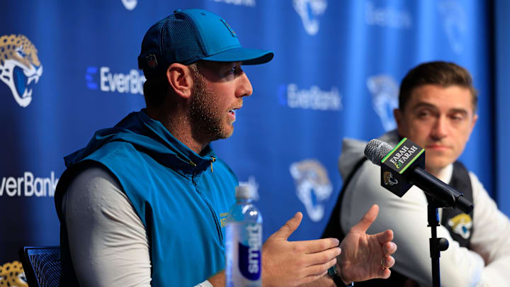 Jacksonville Jaguars head coach Liam Coen speaks during a press conference as general manager James Gladstone looks on at the Miller Electric Center, Wednesday, Jan. 14, 2026, in Jacksonville, Fla.