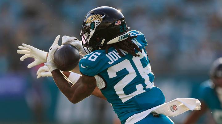 Jacksonville Jaguars safety Antonio Johnson (26) effectively ends the game on an interception against New York Jets wide receiver Arian Smith (82) during the fourth quarter of an NFL football matchup at EverBank Stadium, Sunday, Dec. 14, 2025, in Jacksonville, Fla. The Jaguars defeated the Jets 48-20. [Corey Perrine/Florida Times-Union]