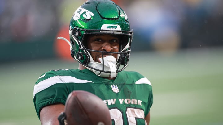 Dec 10, 2023; East Rutherford, New Jersey, USA; New York Jets running back Breece Hall (20) celebrates after a touchdown reception during the second half against the Houston Texans at MetLife Stadium. 