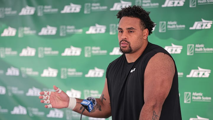 Jul 27, 2024; Florham Park, NJ, USA; New York Jets offensive tackle Olu Fashanu (74) talks with media during training camp at Atlantic Health Jets Training Center. Jul 27, 2024; Florham Park, NJ, USA; New York Jets offensive tackle Olu Fashanu (74) talks with media during training camp at Atlantic Health Jets Training Center.