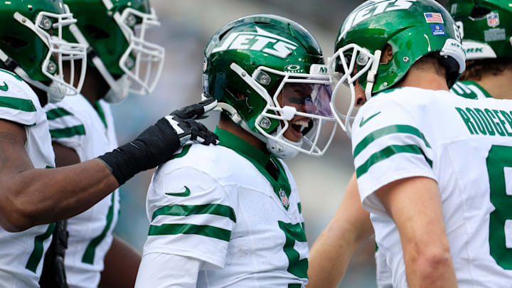 New York Jets wide receiver Garrett Wilson (5) is celebrated for his touchdown score by New York Jets quarterback Aaron Rodgers (8) during the first quarter Sunday, Dec. 15, 2024 at EverBank Stadium in Jacksonville, Fla. New York Jets wide receiver Garrett Wilson (5) is celebrated for his touchdown score by New York Jets quarterback Aaron Rodgers (8) during the first quarter Sunday, Dec. 15, 2024 at EverBank Stadium in Jacksonville, Fla.