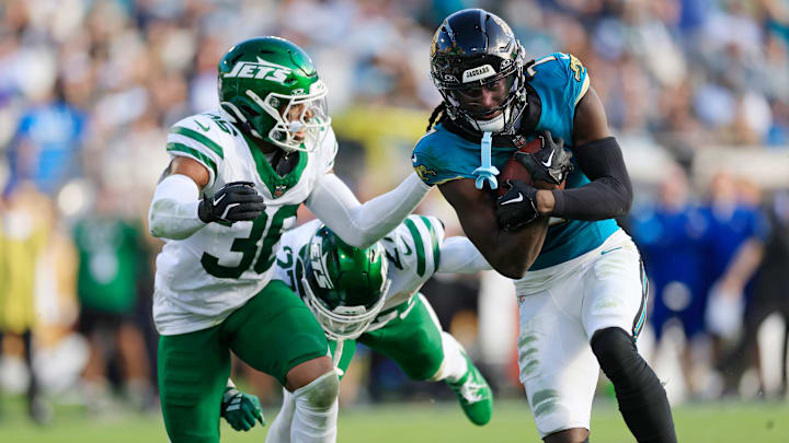 Jacksonville Jaguars wide receiver Brian Thomas Jr. (7) beats out New York Jets safety Chuck Clark (36) and cornerback Kendall Sheffield (27) for a touchdown score during the fourth quarter Sunday, Dec. 15, 2024 at EverBank Stadium in Jacksonville, Fla. The Jets held off the Jaguars 32-25. 