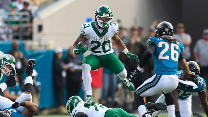 New York Jets running back Breece Hall (20) leaps while rushing for yards during the third quarter Sunday, Dec. 15, 2024 at EverBank Stadium in Jacksonville, Fla. The Jets held off the Jaguars 32-25.